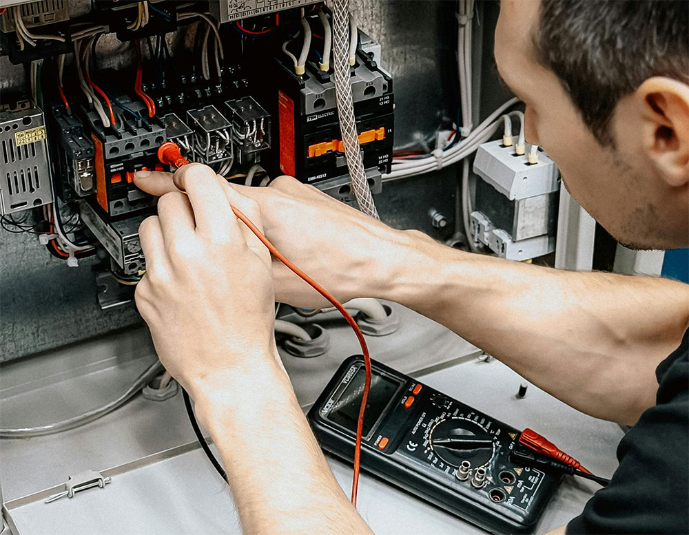 Electrical testing and troubleshooting of wiring inside electrical cabinet using measuring equipment